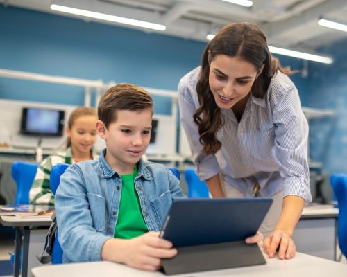 woman-looking-into-tablet-student-boy_259150-60234